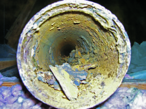 Pipe with obstructive pieces of corrosive buildup inside